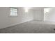 Light-filled bedroom with neutral walls, carpet, a window, and a spacious closet at 4735 W Park Pl, North Charleston, SC 29405