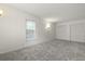 Neutral bedroom with carpet, closet space, and a window for natural light at 4735 W Park Pl, North Charleston, SC 29405