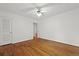 Simple bedroom with hardwood floors, with access to a closet and other rooms at 4735 W Park Pl, North Charleston, SC 29405