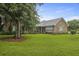 Beautiful brick home featuring a large front yard with mature trees at 4735 W Park Pl, North Charleston, SC 29405