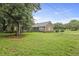 Brick house with a large front yard and mature trees at 4735 W Park Pl, North Charleston, SC 29405