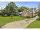Brick house with large yard and driveway at 4735 W Park Pl, North Charleston, SC 29405