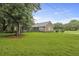 Charming brick home with a lush green lawn and mature trees, offering great curb appeal at 4735 W Park Pl, North Charleston, SC 29405