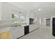 Kitchen featuring a stainless steel sink, modern appliances, white cabinets, and natural light at 4735 W Park Pl, North Charleston, SC 29405