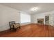 Spacious living room featuring hardwood floors, fireplace and natural light at 4735 W Park Pl, North Charleston, SC 29405