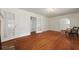 Open living room with hardwood floors, fireplace, and access to other rooms at 4735 W Park Pl, North Charleston, SC 29405