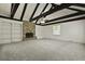 Spacious living room featuring vaulted ceiling with beams and a brick fireplace at 4735 W Park Pl, North Charleston, SC 29405
