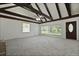Bright living room with vaulted ceiling, dark beams, and large windows for natural light at 4735 W Park Pl, North Charleston, SC 29405