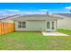 Well maintained backyard featuring a short fence, a small patio, and a well-maintained lawn at 4831 Carnoustie Ct, Summerville, SC 29485