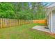 The property showcases a fenced backyard with a small patio, offering privacy and a space for outdoor enjoyment at 4831 Carnoustie Ct, Summerville, SC 29485