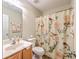 Cozy bathroom featuring a single sink, toilet, and shower with patterned curtain at 4831 Carnoustie Ct, Summerville, SC 29485