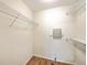 Walk-in closet with wooden floors and white wire shelving for optimal storage at 4831 Carnoustie Ct, Summerville, SC 29485