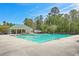A community pool provides a refreshing escape with ample seating and a covered area for relaxation at 4831 Carnoustie Ct, Summerville, SC 29485