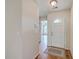 Welcoming foyer featuring hardwood floors, a white front door and a glimpse of the living area beyond at 4831 Carnoustie Ct, Summerville, SC 29485