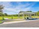 Golf course shelter with an expansive green lawn, perfect for a relaxing day on the course at 4831 Carnoustie Ct, Summerville, SC 29485