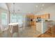 The kitchen with an adjacent dining area features stainless steel appliances and ample cabinet space at 4831 Carnoustie Ct, Summerville, SC 29485