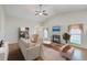 Spacious living room with a fireplace, featuring hardwood floors and comfortable seating, perfect for relaxation and entertaining at 4831 Carnoustie Ct, Summerville, SC 29485