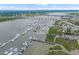 Aerial view of marina with several boat slips and lots of boats at 55 Ashley Ave # 6, Charleston, SC 29401