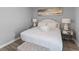 Comfortable bedroom with a plush bed, stylish side tables, and neutral decor at 55 Ashley Ave # 6, Charleston, SC 29401