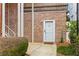 Charming red brick townhouse with white trim and a welcoming front door, number 6 at 55 Ashley Ave # 6, Charleston, SC 29401