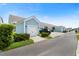 View of a detached garage in a neighborhood with charming curb appeal and a well-maintained exterior at 557 Blueway Ave, Summerville, SC 29486