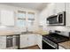 Bright kitchen featuring white cabinets, granite countertops, stainless steel appliances, and subway tile backsplash at 557 Blueway Ave, Summerville, SC 29486