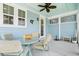 Inviting patio with outdoor seating and bright blue accents, providing a comfortable space for entertaining at 557 Blueway Ave, Summerville, SC 29486