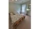 Bedroom with wooden-framed bed and soft, neutral decor at 605 Pointe Of Oaks Rd, Summerville, SC 29485