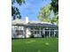 Well-maintained home exterior with a lush green lawn and large windows providing natural light at 605 Pointe Of Oaks Rd, Summerville, SC 29485