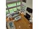 Open-concept living room featuring large windows, vaulted ceilings, a fireplace, and hardwood floors at 605 Pointe Of Oaks Rd, Summerville, SC 29485
