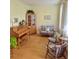 Cozy living room with hardwood floors, comfortable seating, and a charming vintage piano at 605 Pointe Of Oaks Rd, Summerville, SC 29485