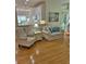 Cozy living room with hardwood floors and comfortable seating arrangement at 605 Pointe Of Oaks Rd, Summerville, SC 29485