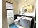 Bathroom featuring tiled walls, tile flooring, and a modern vanity at 6212 Fieldstone Cir, Charleston, SC 29414