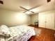 Minimalist bedroom with light green walls, a ceiling fan and a closet at 6212 Fieldstone Cir, Charleston, SC 29414