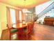 Dining room area with hardwood floors, a round table with seating, and a view of the foyer at 6212 Fieldstone Cir, Charleston, SC 29414