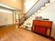 Entryway with hardwood floors, staircase, console table, and double doors at 6212 Fieldstone Cir, Charleston, SC 29414
