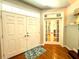 Bright foyer features a hardwood floor, a double-door entry, and a view of the interior at 6212 Fieldstone Cir, Charleston, SC 29414
