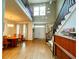 Bright foyer featuring a hardwood floor, chandelier, staircase, and a double-door entry at 6212 Fieldstone Cir, Charleston, SC 29414