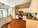 Classic kitchen with stainless steel appliances, granite countertops, and views of the living area at 6212 Fieldstone Cir, Charleston, SC 29414