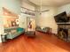 Open-concept living room with hardwood floors, high ceilings, fireplace, and a view of the staircase at 6212 Fieldstone Cir, Charleston, SC 29414