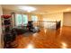 Open loft area with hardwood floors, exercise equipment, and natural light at 6212 Fieldstone Cir, Charleston, SC 29414