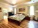 Bedroom with a spacious layout, light hardwood floors, and natural light, creating a serene retreat at 6212 Fieldstone Cir, Charleston, SC 29414