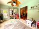 Play room with tile flooring, neutral paint, with an access door to the back yard at 6212 Fieldstone Cir, Charleston, SC 29414