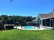 Backyard swimming pool with patio, screened in porch and a shed at 6212 Fieldstone Cir, Charleston, SC 29414