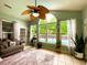 Bright sun room with tile floors, large windows overlooking the pool, and a comfortable seating area at 6212 Fieldstone Cir, Charleston, SC 29414