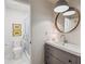 This bathroom features a modern vanity, toilet, and glass-enclosed shower with flower-themed decor at 705 Williamson Dr # C, Mount Pleasant, SC 29464