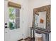Light-filled entryway with decorative mirror and view to the exterior at 705 Williamson Dr # C, Mount Pleasant, SC 29464