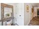 Stylish entryway with decorative mirror and a view into the dining area at 705 Williamson Dr # C, Mount Pleasant, SC 29464