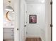 Hallway adjacent to a bathroom with white wainscoting and gray vanity at 705 Williamson Dr # C, Mount Pleasant, SC 29464