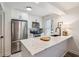 Bright kitchen features stainless steel appliances, white cabinets, marble countertops, and modern fixtures at 705 Williamson Dr # C, Mount Pleasant, SC 29464